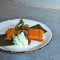 Tamal de calabaza y maíz, relleno de cerdo, con ají de leche. El Tarantín Cocina venezolana